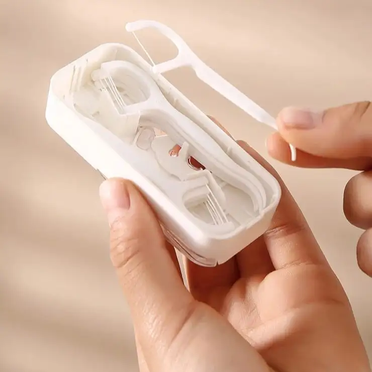 Dispenser til tandtråd